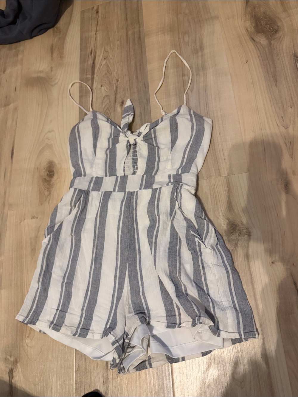 Size xs white and blue striped sky and sparrow romper with cutout and tie detail